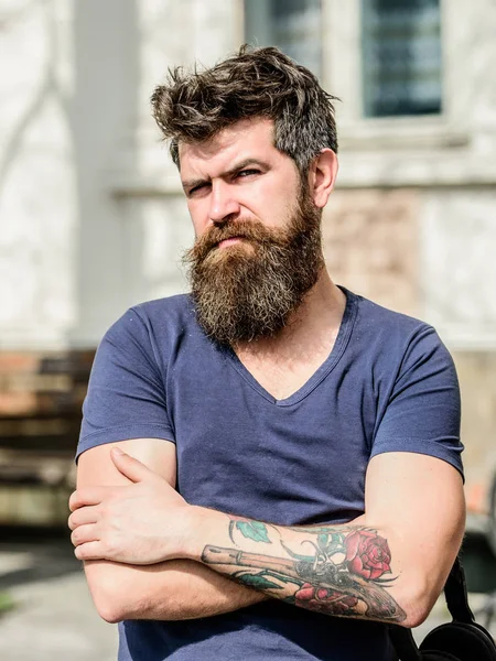 Bearded man outdoor. Beard care and barbershop. brutal male with perfect style. bearded man with lush hair. serious male. male fashion and beauty. Mature hipster with beard. Making his beard perfect