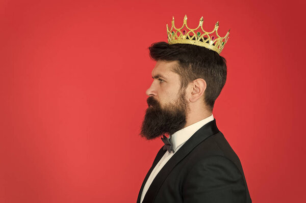 King attribute. Narcissistic king. Self confidence concept. Handsome hipster formal suit. Elite society. Feeling superior. Man bearded guy in tuxedo golden crown symbol of monarchy. King ceremony