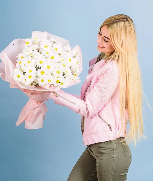 Adore flowers. Girl tender sensual blonde hold flowers bouquet. Flowers delivery service. Chamomile flower symbol of innocence and tenderness. Celebrating her special day. Surprise for girlfriend