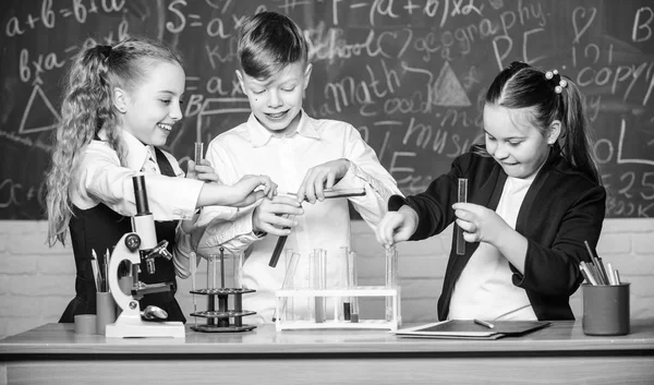 Chemistry is fun. Lab microscope and testing tubes. Chemistry science. biology experiments with microscope. Little kids scientist earning chemistry in school lab. Little children. Science