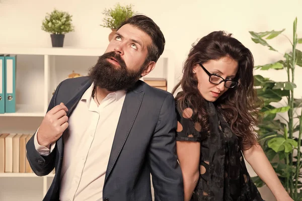 Tired man with beard and sexy woman. Young coworkers. Businesspeople. Teamwork. Business couple in office. Formal fashion dress code. Overtime. Tired from work. Tired office worker. feeling tired