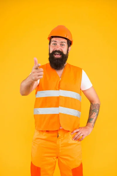 Man engineer protective uniform orange background. Engineering career concept. Architect builder engineer. Good job. Safety apparel for construction industry. Bearded brutal hipster safety engineer — Stock Photo, Image