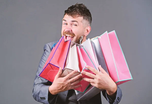 Satisfying shopping tour. Man bearded businessman customer carry many shopping bags. Enjoy shopping profitable deals black friday. Shopping with discount enjoy purchase. Exclusive commercial offer