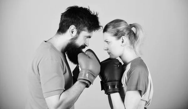 Some call them opponents, I call them victims. woman and bearded man workout in gym. train with coach. sportswear. Fight. knockout energy. couple training in boxing gloves. punching, sport Success