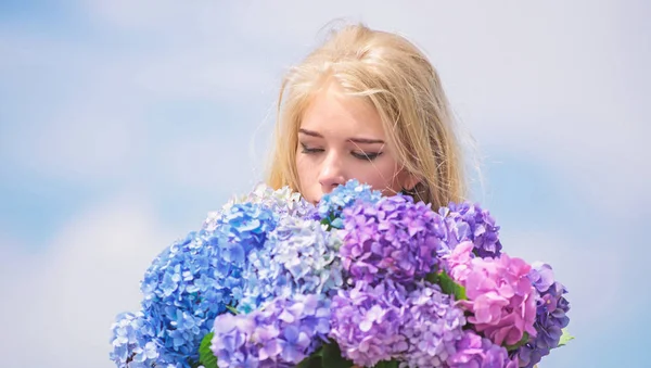 Springtime bloom. Natural beauty concept. Skin care and beauty treatment. Gentle flower for delicate woman. Pure beauty. Tenderness of young skin. Girl tender blonde hold hydrangea flowers bouquet — Stock Photo, Image