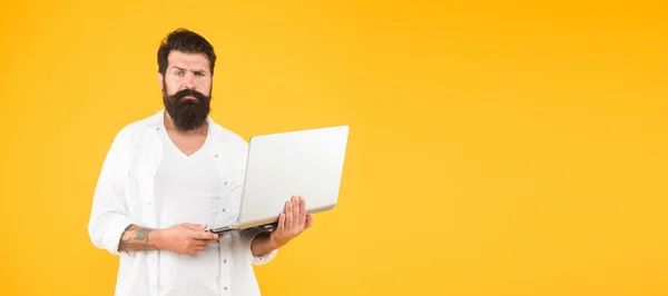 Bearded man with notebook. Online shopping. Man using notebook. Surfing internet. In search of inspiration. Online payment. Online purchase. Digital world. Programming concept. Programmer with laptop