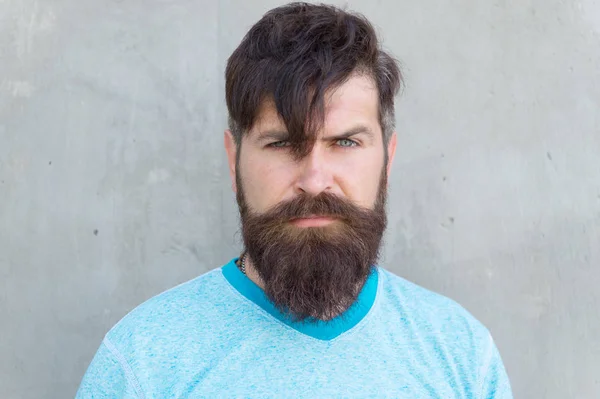 Long hair. Cut bangs. Cool hipster with beard need haircut. Barber salon and facial care. Hipster lifestyle. Brutal handsome mature hipster man. Bearded man trendy style. Beard and mustache grooming