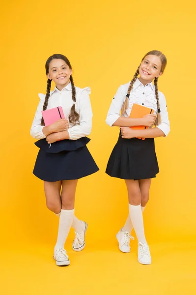 School friendship. Friendship goals. Cute school girls with books. First day at school. Most important thing one learns in school is self esteem support and friendship. Kids best friends classmates — Stock Photo, Image