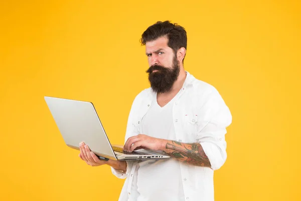 Online purchase. Man using notebook. Programming concept. Bearded man with notebook.Digital world. Successful developer. Online shopping. Programmer with laptop. Surfing internet. Online payment