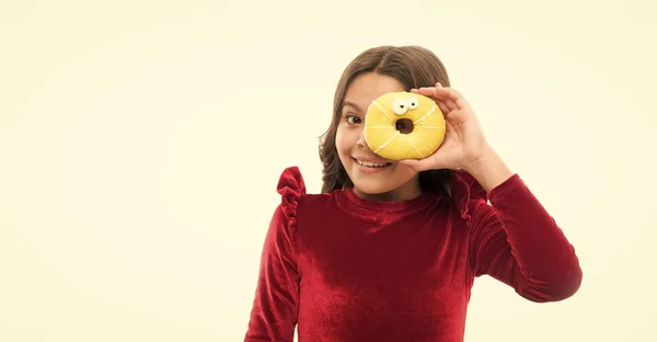 Capturing bright moment. childhood happiness. small girl in red dress. happy childrens day. sweet life. healthy eating and dieting. food. dental care. birthday party. copy space. child with donat