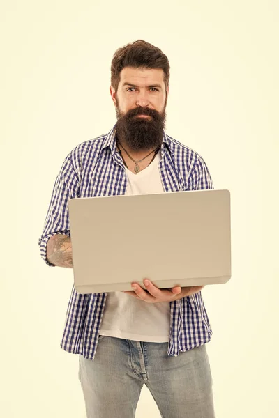 Social media marketing expert. Man with laptop works as smm expert web developer or programmer. Remote job. Freelance job. IT developer. Modern occupation. Guy bearded man brutal web developer