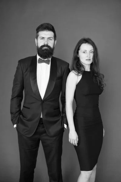 Award ceremony concept. Bearded gentleman wear tuxedo girl elegant dress. Formal dress code. Visiting event or ceremony. Couple ready for award ceremony. Main rules picking clothes. Corporate party