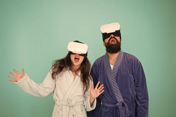 Future life. Good morning. Couple in love. Family. Virtual reality. Love. Happy family in vr glasses. Bearded man and woman in robe pajama. Future is now. Future technology. Vr glasses is our future