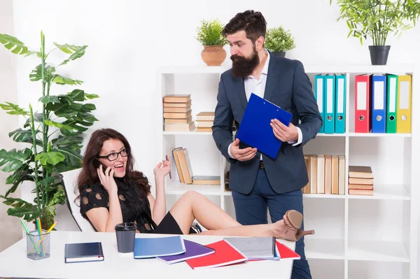 Important conversation. Communication problem. Competing for her attention with phone. Woman boss having phone call while colleague try to talk. Busy lady. Phone negotiations. Mobile addicted