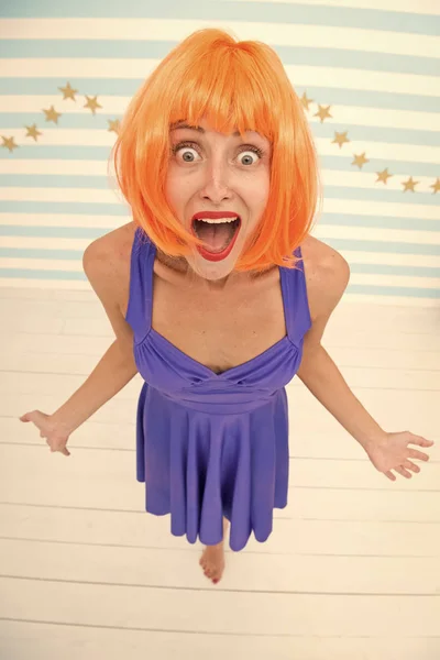 this is unbelievable. crazy girl with happy or surprise emotions on face. it looks unbelievable. crazy girl with orange hair. surprise moment. wow. what a wonderful gift.