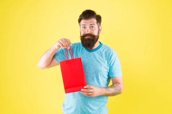 Shop store mall boutique. Buy product. Aspects can influence customer decision making behavior. Happy hipster hold paper bag. Bearded man smiling with purchase. Impulse purchase. Shopping concept — Stock Photo, Image
