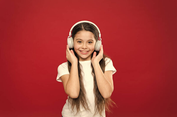 Music taste. Music plays an important part lives teenagers. Powerful effect music teenagers their emotions, perception of world. Girl listen music headphones on red background. Play list concept