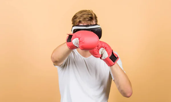 Explore cyber space. Cyber sportsman boxing gloves. Augmented 3D world. Man boxer virtual reality headset simulation. Man play game in VR glasses. Cyber sport concept. Cyber coach online training — Stock Photo, Image