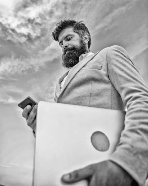 Top qualities of excellent manager. Man well groomed bearded hipster holds laptop blue sky background. Guy formal suit modern technology manager entrepreneur. Keep in touch. Modern communications — Stock Photo, Image