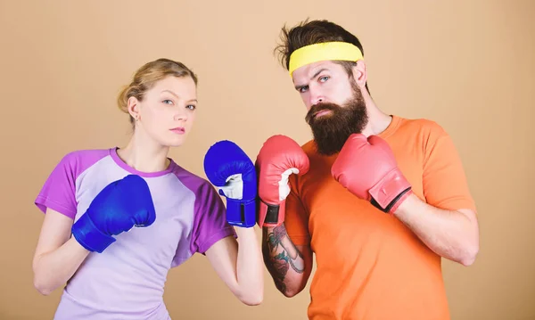 One spirit, one team, one win. punching, sport Success. sportswear. Fight. training with coach. Happy woman and bearded man workout in gym. knockout and energy. couple training in boxing gloves — Stock Photo, Image
