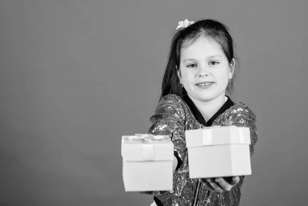 Girl with gift boxes blue background. Black friday. Shopping day. Cute child carry gift boxes. Surprise gift box. Birthday wish list. World of happiness. Special happens every day. Choose one