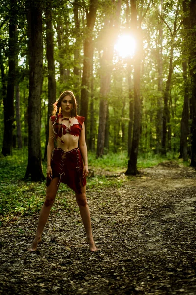 Wilderness of virgin woods. Wild attractive woman in forest. Folklore character. Living wild life untouched nature. Sexy girl. Wild human. Female spirit mythology. She belongs tribe warrior women