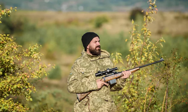 Hunting masculine hobby. Man brutal gamekeeper nature background. Hunter hold rifle. Bearded hunter spend leisure hunting. Focus and concentration of experienced hunter. Hunting and trapping seasons — Stock Photo, Image