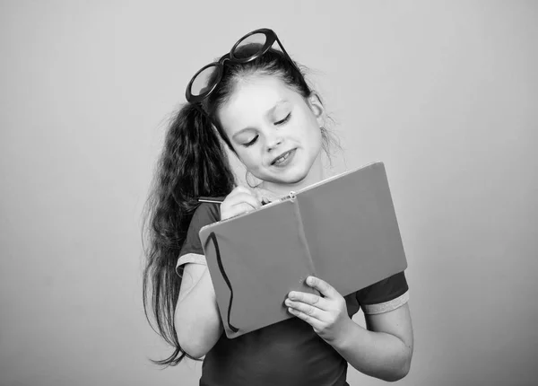 Hobby and leisure. Top funny books to read. Beach reads for summer. Child likes reading book. Popular vacation books. Literature concept. Great books for summer vacation. Girl in sunglasses hold book — Stock Photo, Image