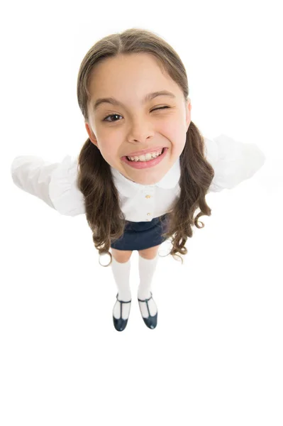 Cheerful smile. Student little kid adores school. Pupil of first grade. Celebrate knowledge day. September time to study. Girl cute pupil on white background. School uniform. Back to school — Stock Photo, Image