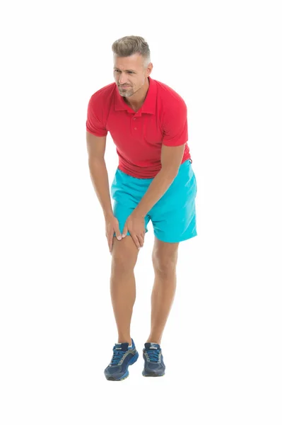 Joints care. Sportsman with knee pain on white background. Man suffer from pain. Health problem. Sport injury. Medical aid treatment therapy. Sport and fitness. Joint injury. Sudden injury — Stock Photo, Image