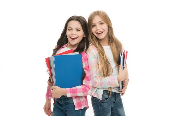Back to school on September 1. Adorable little girls holding school exercise books. Small school children with note books. Ideal books to take to school for a wide variety of subjects — Stock Photo, Image