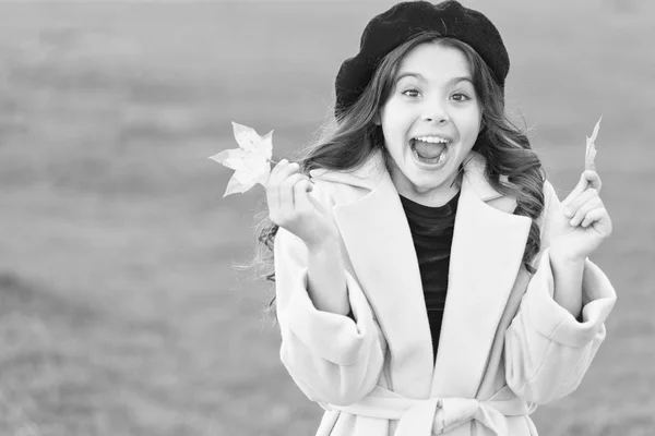 Little girl excited about autumn season. Tips for turning autumn into best season. Kid girl smiling face hold maple leaves. Child with autumn maple leaves walk. Autumn coziness is just around — Stock Photo, Image