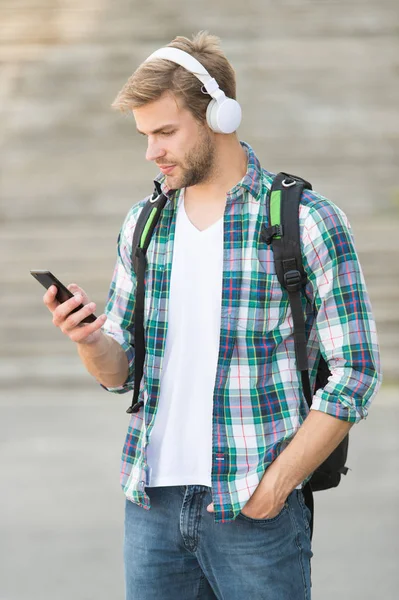 E learning. College student headphones smartphone. Online learning. Audio book concept. Educational technology use of both physical hardware software and educational theoretic to facilitate learning