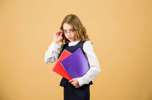 Final exam coming. Girl hold textbook folder test. School exam concept. Prepare for exam. Preparing to exams in library. Small child formal wear. Formal education and homeschooling. Check knowledge — Stock Photo, Image