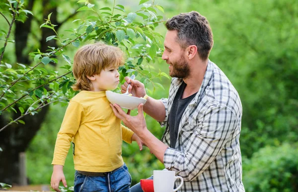 Healthy nutrition concept. Feeding baby. Menu for children. Family enjoy homemade meal. Father son eat food and have fun. Nutrition habits. Little boy and dad eating. Nutrition for kids and adults — Stock Photo, Image