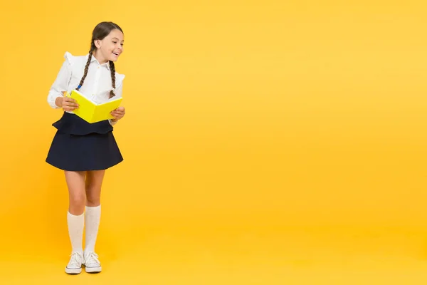 Learn following rules. Welcome back to school. School lesson. Study literature. Inspirational quotes motivate kids for academic year ahead. School girl formal uniform hold book. Towards knowledge — Stock Photo, Image