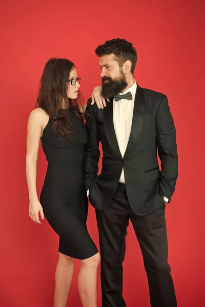 couple in love on date. business meeting fashion. formal fashion look. Proposal or engagement party. Formal couple of man in tuxedo and sexy woman. Bearded tuxedo man and woman. Always in style