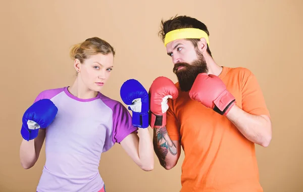Be careful. Boxing sport concept. Couple girl and hipster practicing boxing. Sport for everyone. Amateur boxing club. Equal possibilities. Strength and power. Man and woman in boxing gloves