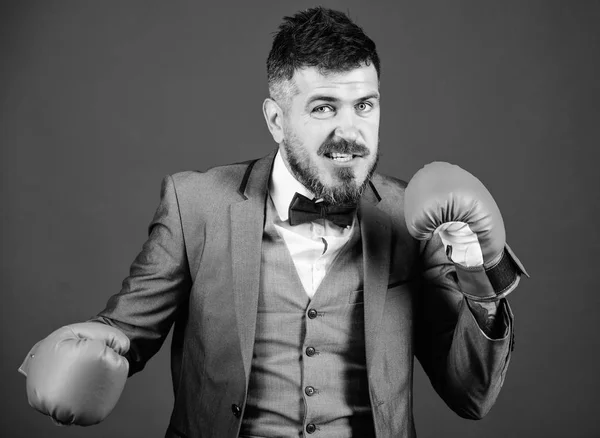 Business and sport success. businessman in formal suit and tie. powerful man boxer ready for corporate battle. man in boxing gloves punching. knockout and energy. Fight. Never give up and keep moving