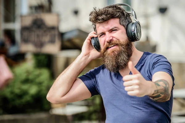 Handsome man listen to music in headphones. Music in heart. In love with music. brutal caucasian hipster with moustache. Bearded man. Music is so much fun. Mature hipster with beard. Cool and sexy