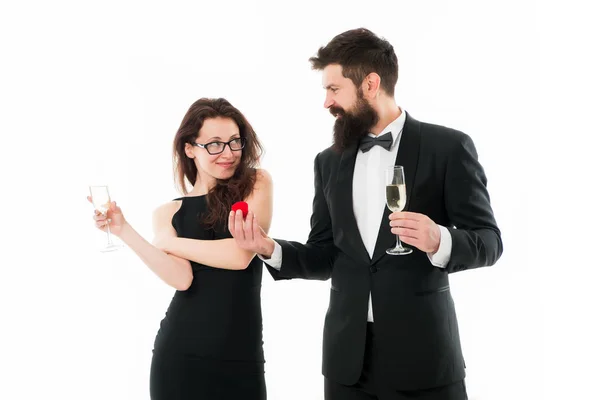 happy man in tuxedo do proposal to sexy woman. couple in love celebrate engagement with champagne. wedding is soon. love couple. Can not believe this is happening. Ring is perfect. Will you marry me