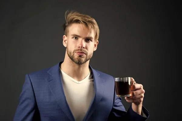 Man formal elegant suit enjoy coffee dark background. Businessman elegant guy drink tea or coffee. Morning coffee concept. Break for relax and recharge energy caffeine beverage. Have cup of coffee