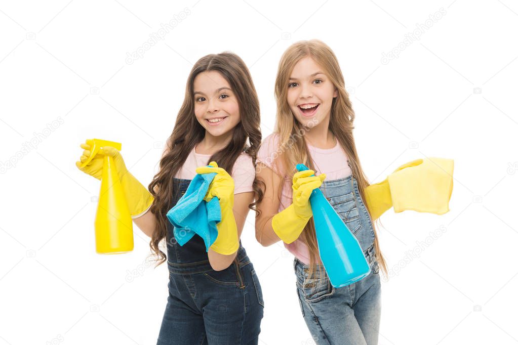 Dirt is not welcome in our home. Adorable little girls wearing household rubber gloves. Small children holding household spray bottles. Enjoying household activities. Providing household help