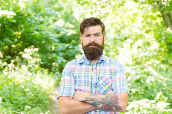 Eco lifestyle. United with environment. Handsome lumberjack. Man beard and mustache in summer forest. Summer vacation concept. Man bearded hipster green trees background. Guy relax in summer nature — Stock Photo, Image