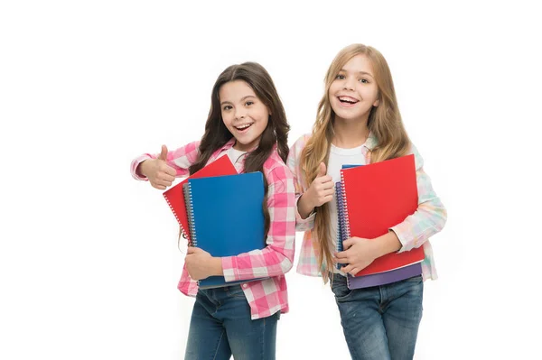 We love study. School stationery. Pupils carrying big textbooks to school classes. Taking extra classes. Girls with school textbooks white background. Happy to be students. School supplies concept — Stock Photo, Image