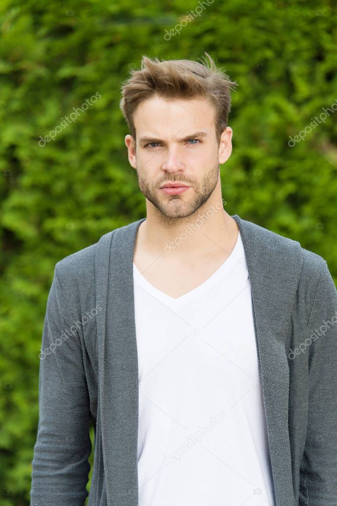 Bearded guy casual style. Barbershop service. Handsome macho. Fundamentals of good dressing. Handsome man unshaven face and stylish blond hair. Handsome caucasian man nature green background