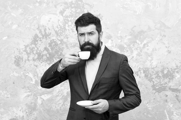 Tailor or fashion designer. Male fashion model. Mature businessman. elegant man with beard drink coffee. Modern life. Brutal bearded hipster in formal suit. perfect breakfast. Businessman at work