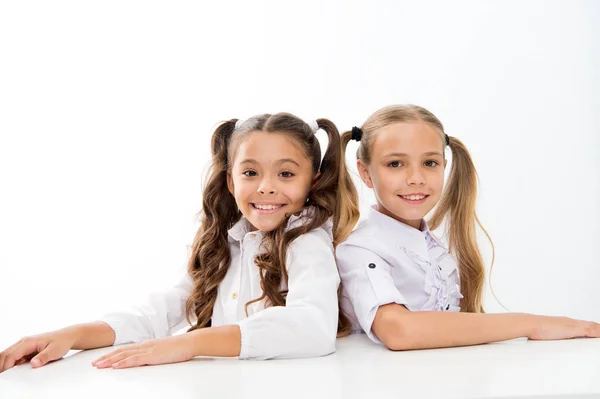 Home schooling. Adorable pupils sitting at desks isolated on white. Little children enjoy private schooling. Small schoolgirls having compulsory schooling. Schooling years — Stock Photo, Image