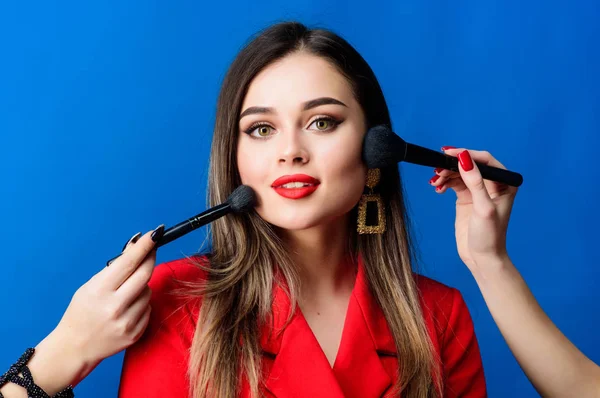Perfect skin tone. Stunning beauty. Makeup supplies shop. Makeup courses. Gorgeous lady make up red lips. Skin care. Cosmetics concept. Beauty salon facial care. Pretty woman applying makeup brush — Stock Photo, Image