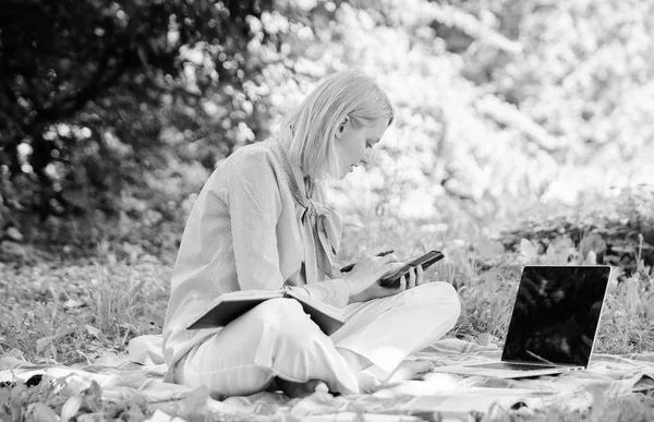 Woman with laptop sit grass meadow. Business lady freelance work outdoors. Become successful freelancer. Freelance career concept. Guide starting freelance career. Managing business outdoors